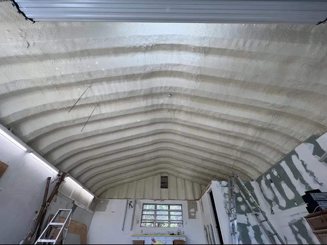 Spray polyurethane foam applied to the underside of a metal roof deck in Pequea